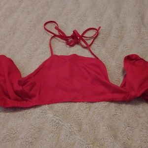 Crop top with puffy sleeves, tie behind neck and tie behind back. Backless.